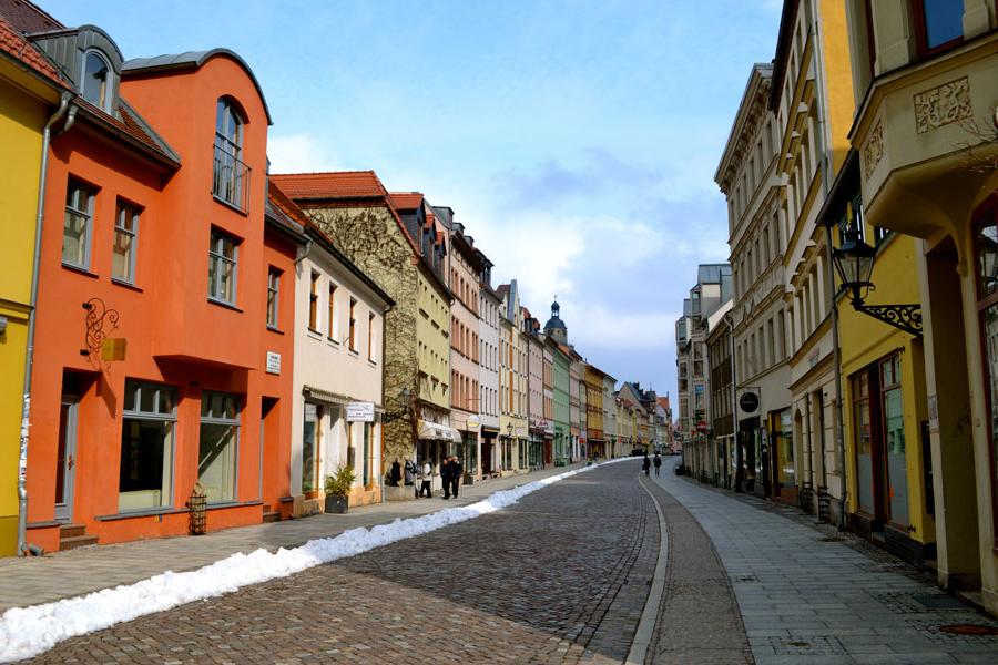 Colorful houses lined along Whittenburg Street, a cobblestone street in Germany.